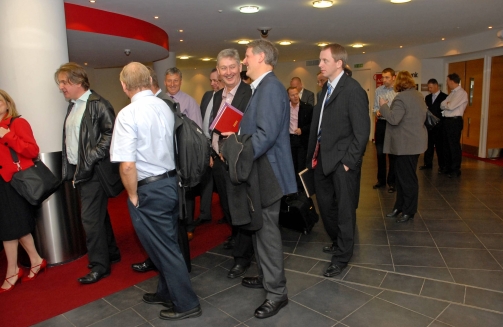 KDM Events - Conference Management Company - Group queues to enter main conference meeting room'